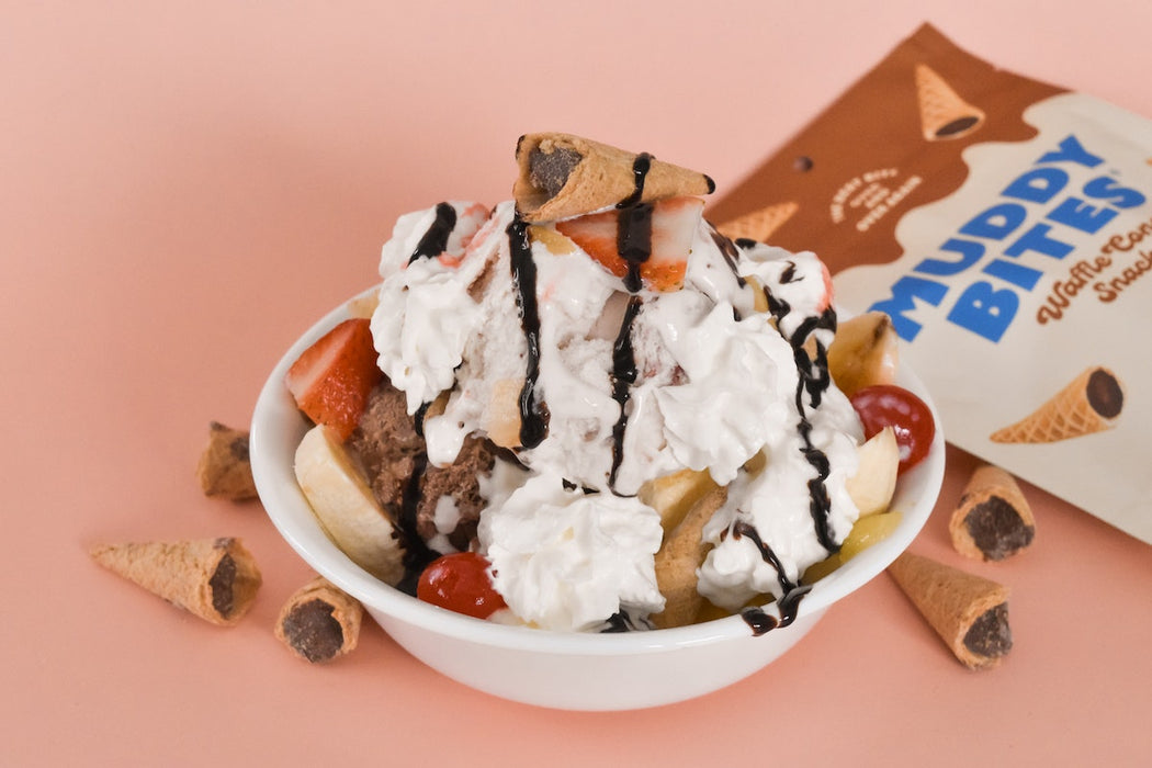 Banana split garnished with Muddy Bites for extra crunch.