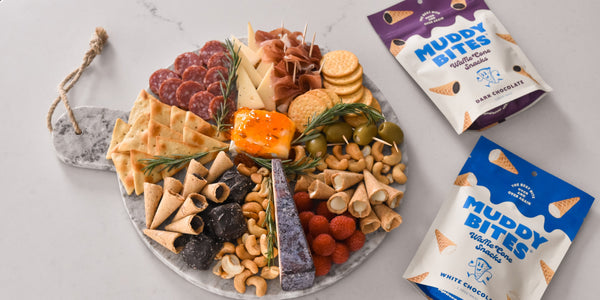 Close-up of a festive snack table featuring Muddy Bites, a popular treat.