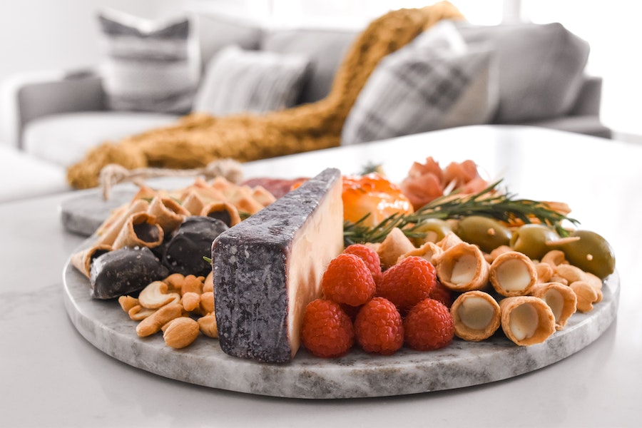 Photo of a snack plate featuring Muddy Bites, with a cozy couch in the background.