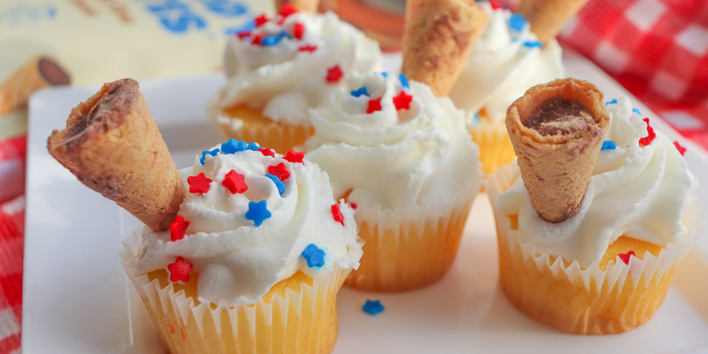 Cupcakes celebrating Independence Day with red, white, and blue frosting.