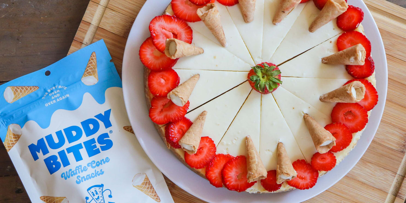 Creamy cheesecake garnished with Muddy Bites.